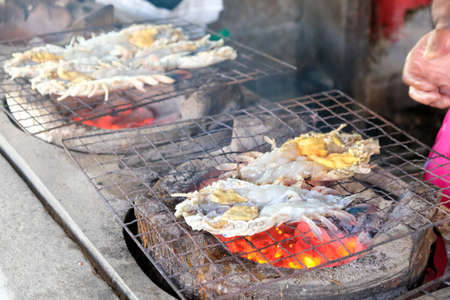 Grilled Giant River Prawns On Fire. Photo of cook by grilling shrimp with Charcoal  in Traditional Thai style.の写真素材