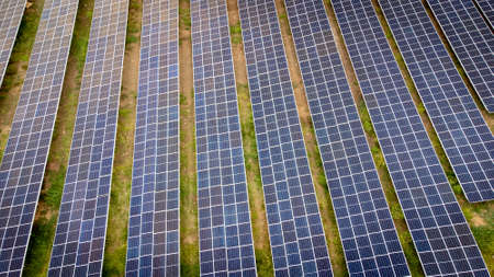 Aerial view over a modern solar farm. Solar panels station for collect green energy on concept of...