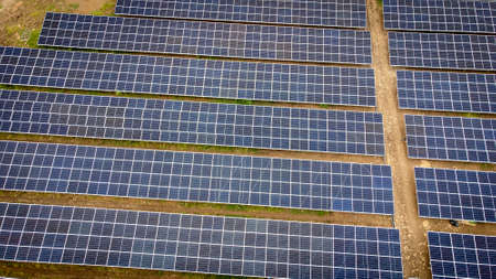 Aerial view over a modern solar farm. Solar panels station for collect green energy on concept of...