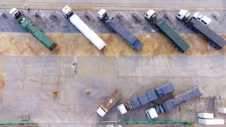 Semi Trucks in Warehouse during transportation on leading commodity. Photo of logistic from Aerial View.の写真素材
