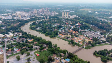 Tha Ruea, Ayutthaya, Thailand - October 2021: Flood waters overtake a house and rice field in area...