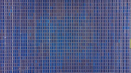 Solar panels on water in aerial view, rows array of polycrystalline silicon solar cells or photovoltaics in Floating Solar Farm on the water in lake.の写真素材