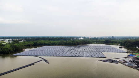 Solar panels on water in aerial view, rows array of polycrystalline silicon solar cells or...