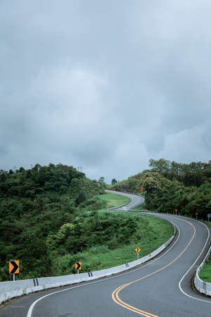 Road no.3 or sky road on Root 1081 over top of mountains with green jungle in Santisuk - Bo Kluea District, Nan province, Thailand.の写真素材