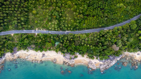 Ocean Road and sand beach in Khanom Sichon Road at Khao Phlai Dam, Nakorn Sri Thammarat province, Thailand. Shot by Drone Aerial Viewの写真素材