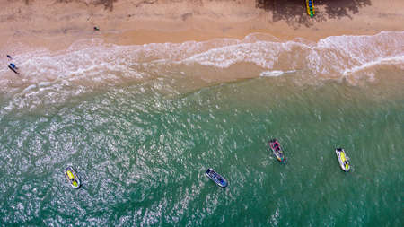 Aerial view of clear turquoise sea on sandy beach and ocean with waves.のeditorial素材