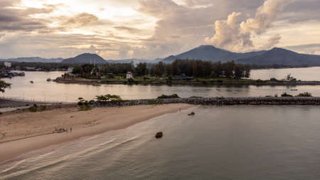 Beach in the morning during sunrise composed by the golden light of the sun
