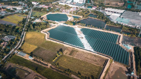 Aerial view of a solar farm producing clean energy during the evening with twilight and visible all around areaの写真素材