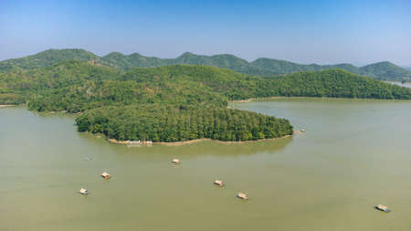Loei Province, Thailand - December 2021 : Area of Huai Krathing reservoir with bamboo raft shelter for Rafting and Eating. Beautiful natural landscape of the river and mountain with blue skyのeditorial素材