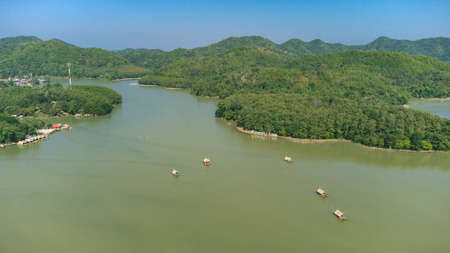 Area of Huai Krathing reservoir with bamboo raft shelter for Rafting and Eating. Beautiful natural landscape of the river and mountain with blue skyの写真素材