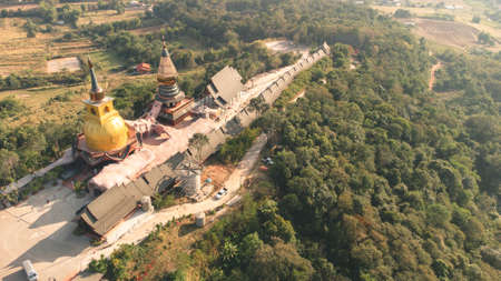 Wat Somdet Phu Ruea Ming Mueang Temple fly over aerial view. Temple is built with fine wood timber. The church is made of teak and locate on mountain and best viewpoint at Phu ruea, Loei, Thailandの写真素材