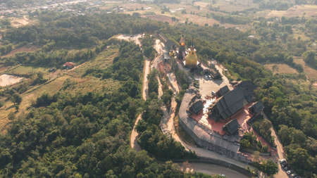 Wat Somdet Phu Ruea Ming Mueang Temple fly over aerial view. Temple is built with fine wood timber. The church is made of teak and locate on mountain and best viewpoint at Phu ruea, Loei, Thailandの写真素材