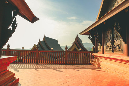 Loei, Thailand 12,2021 Wat Somdet Phu Ruea Ming Mueang (Temple) The temple is built with fine wood timber. The church is made of teak and locate on mountain and one of top viewpoint at Phu ruea.のeditorial素材