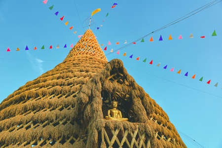 Lom Sak, Phetchabun - December 2021 : Wat Khosa Thachang during sunset. The Pagoda make from rice paddy and interior by fammer which will be built at the end of every yearのeditorial素材