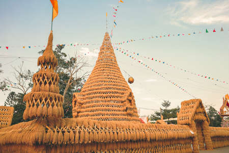 Lom Sak, Phetchabun - December 2021 : Wat Khosa Thachang during sunset. The Pagoda make from rice...
