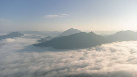 Sea of Fog covers the area on the top of hill Doi Phu Thok, Chiang Khan, Loei, Thailand with background of sunrise on winter.の写真素材