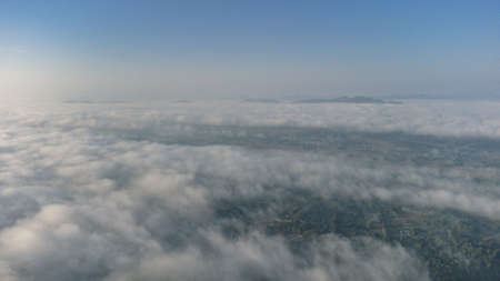 Sea of Fog covers the area on the top of hill Doi Phu Thok, Chiang Khan, Loei, Thailand with background of sunrise on winter.の写真素材