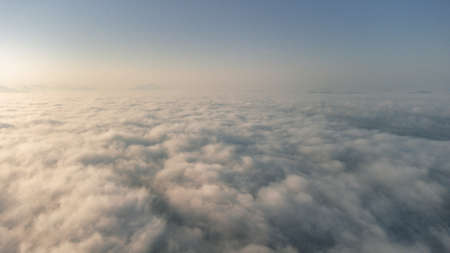 Sea of Fog covers the area on the top of hill Doi Phu Thok, Chiang Khan, Loei, Thailand with background of sunrise on winter.の写真素材