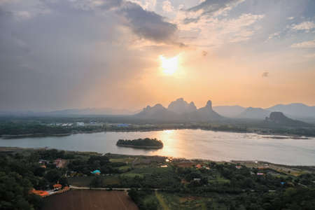 Phu Sub Lek is hidden gem of Lopburi, Thailand to see view of Khao Jeen Lae with unseen sunset sky over the water from lake.の写真素材