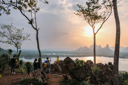 Phu Sub Lek is hidden gem of Lopburi, Thailand to see view of Khao Jeen Lae with unseen sunset sky over the water from lake.のeditorial素材
