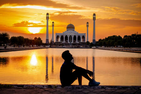 Man in silhoette in area of Central Mosque in Songkhla province, Southern of Thailand. Photo reflection of shadow by polished floorの写真素材