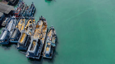 Aerial view of fisherman dock which has many ships anchoring for transport seafood and supplies on island of Songkhla, Thailandの写真素材