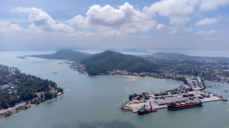 Songkhla island, Thailand - February 2022 : Aerial view of transportation industrial shipping business and cargo ship container. Located on a peninsula that separates the estuary.のeditorial素材
