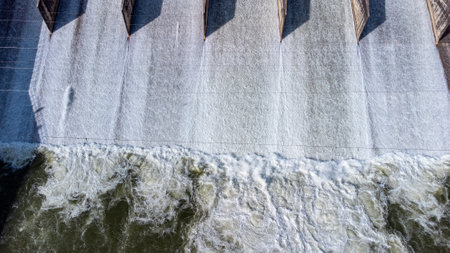 An aerial view over the Pasak Jolasid dam, Lopburi Province, Thailand. Tracking the movement of the floodgates that are releasing water into rural canals in enormous amounts of watの写真素材