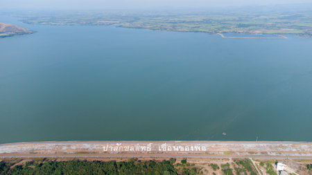 An aerial view over the Pasak Jolasid dam, Lopburi Province, Thailand. Tracking the movement of the floodgates that are releasing water into rural canals in enormous amounts of watの写真素材