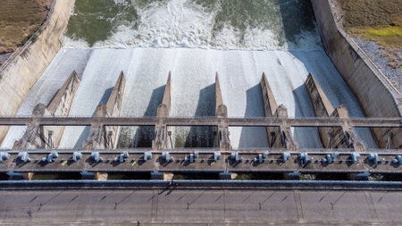 An aerial view over the Pasak Jolasid dam, Lopburi Province, Thailand. Tracking the movement of the floodgates that are releasing water into rural canals in enormous amounts of watの写真素材