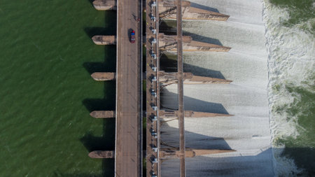 An aerial view over the Pasak Jolasid dam, Lopburi Province, Thailand. Tracking the movement of the floodgates that are releasing water into rural canals in enormous amounts of watの写真素材
