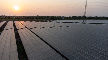 Solar panels for renewable electric energy with sunset sky background, Thailand.の写真素材