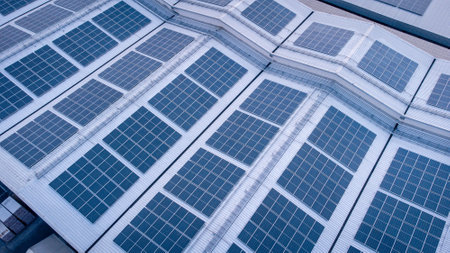 Solar panels on the roof of a building. Photovoltaic modules for renewable electric energy production.の写真素材