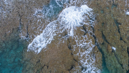 Sea surface in Okinawa with clear water and rock view by drone.の写真素材