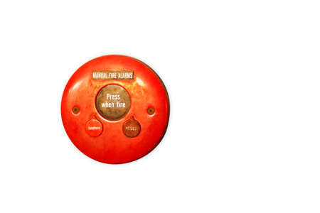 Red fire alarm on a wall - Closeup Red fire alarm button isolated on white background
