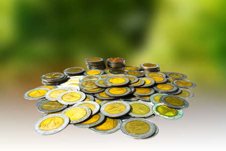 Coin lots of  Thai Baht and green backgroundの写真素材