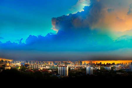 Cityscape under clouds and blue skyの写真素材