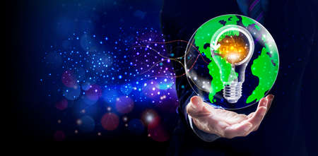 Businessman holding global and light bulb digital network and data customer connection, Social network and data exchange of technology, Networking structure on blue city backgroundの写真素材