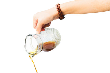 Hand holding coffee mug and pouring hot water coffee