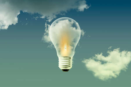 Light bulbs white bright warm light on cloud sky background - Idea thinking and creative concept backgroundの写真素材