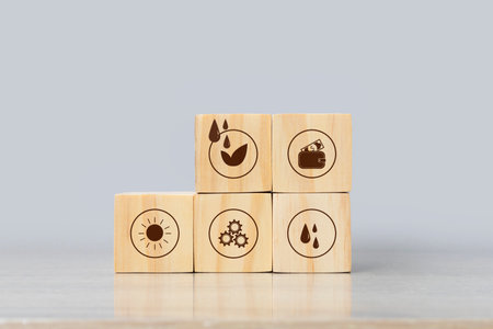 Wooden blocks with icons of eco-friendly products. Sustainable lifestyle concept. Stack wood cube block, global warming, and climate change, offset by planting trees.の写真素材
