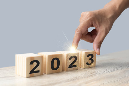 New year 2013 concept. Hand puts wooden cubes with numbers on them.