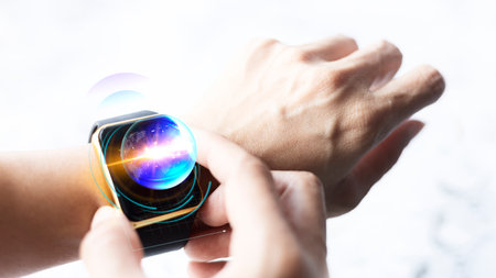 Close-up of a human hand using a smartwatch with planets on screen. Smartwatch hologram mockup,...
