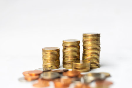 Stacks of coins isolated on white background, business, and finance concept. Business finance money coin investment stock tax and insurance saving concept.の写真素材