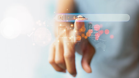 Businessman on blurred background using search bar with his finger. Data search technology SEO...