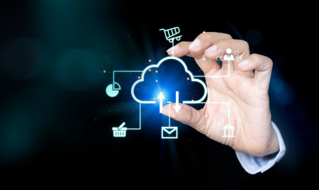 Businessman hand drawing cloud computing icon on virtual screen. Internet and technology concept.