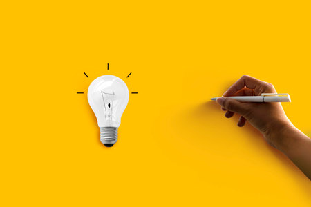 Wood, light bulb on yellow background with the handwriting on the empty space. Earth Day Conceptの写真素材