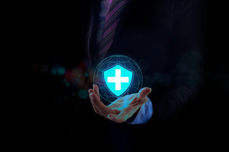 Businessman in a suit with open hands with light design. People health care awareness rising growth of medical health and life insurance business.の写真素材