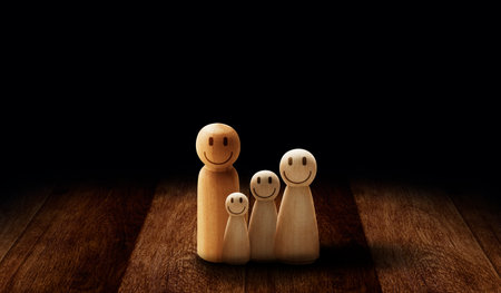 Wooden figures of family members life insurance health protection, Family relationship, Insurance and property investment, homeless support, world mental health day.の写真素材