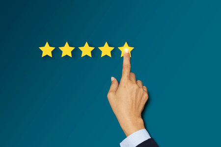 Success positive customer reviews Five-star. Gesture Hand with Golden Five Star Awardsの写真素材
